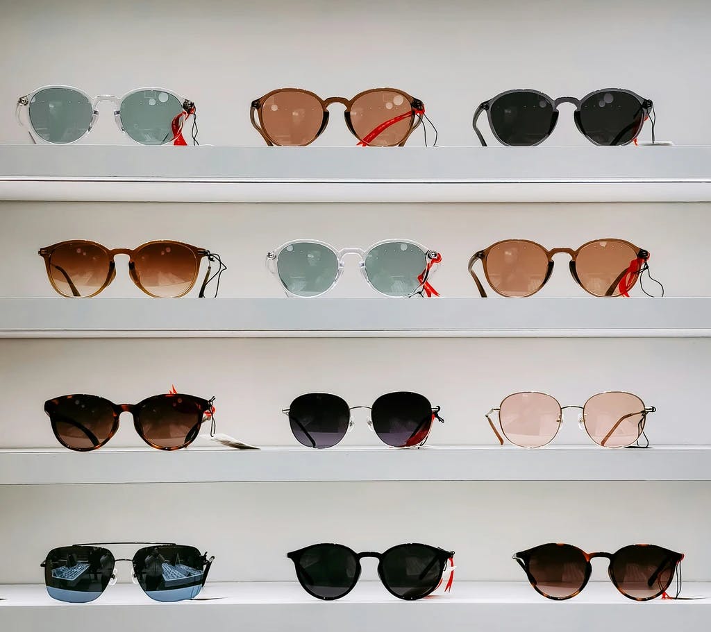 a stand of different sun glasses