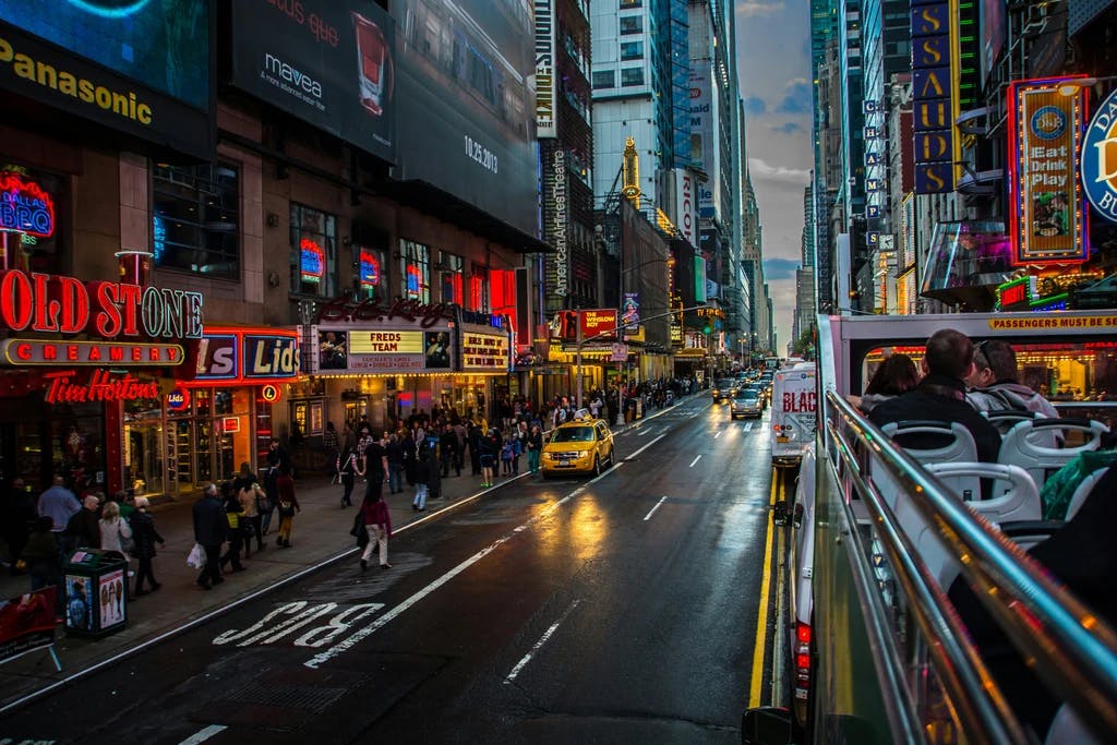 a view down a new york street from a bus