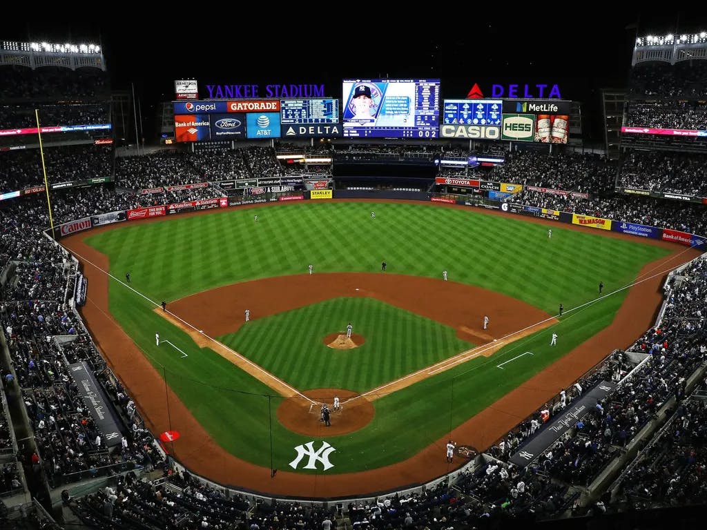 a view of yankee stadium from behind home plate