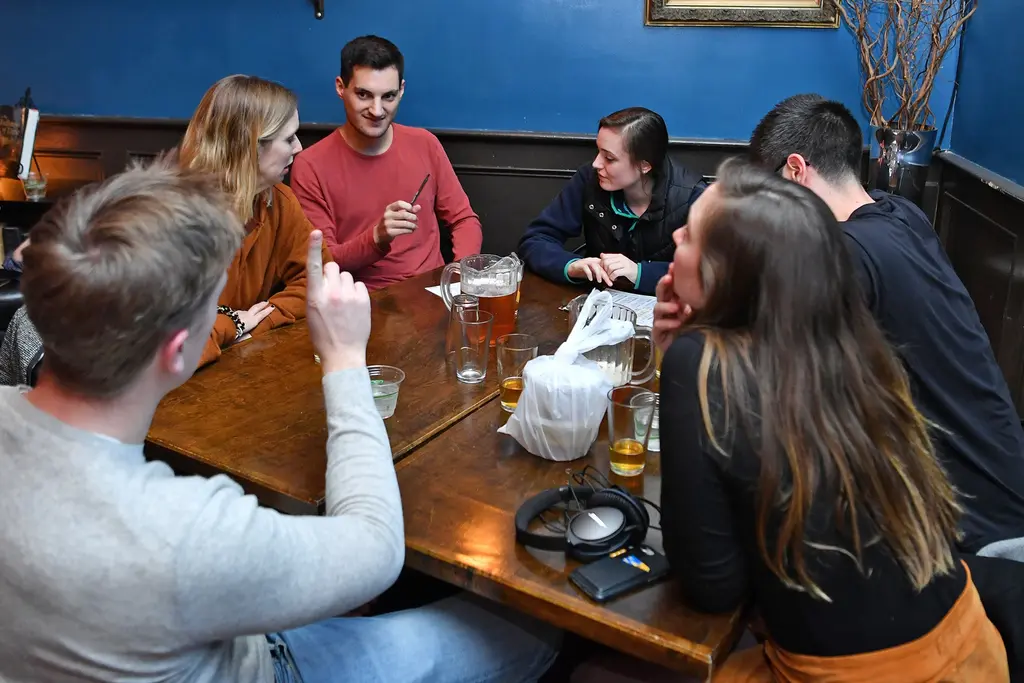Group engaging in trivia conversation