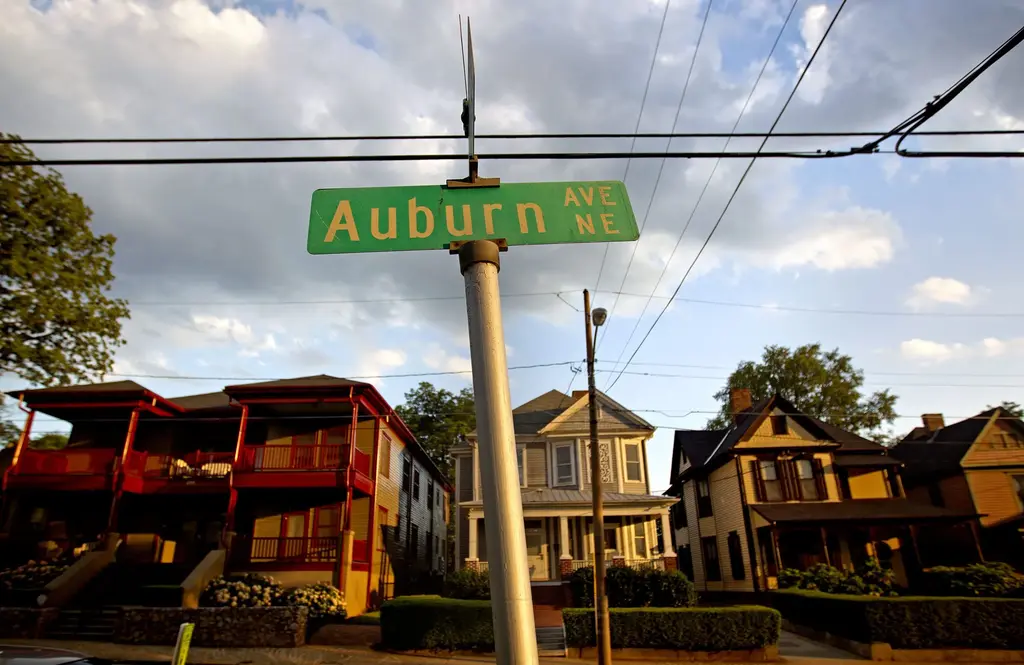 A street sign reading 'Auburn Ave NE' in Atlanta, Georgia, marking the historic neighborhood where Martin Luther King Jr. was born.