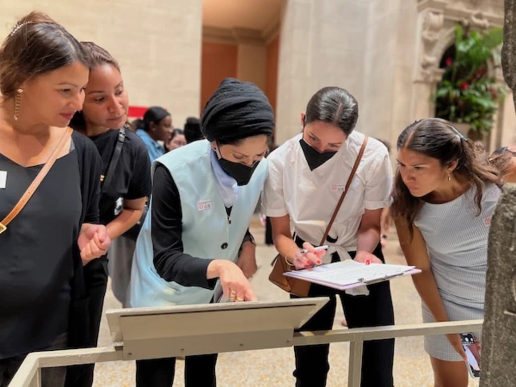 people looking at a display in a museum