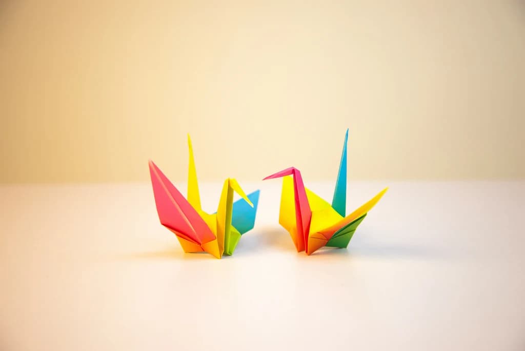 two multicolored origami swans