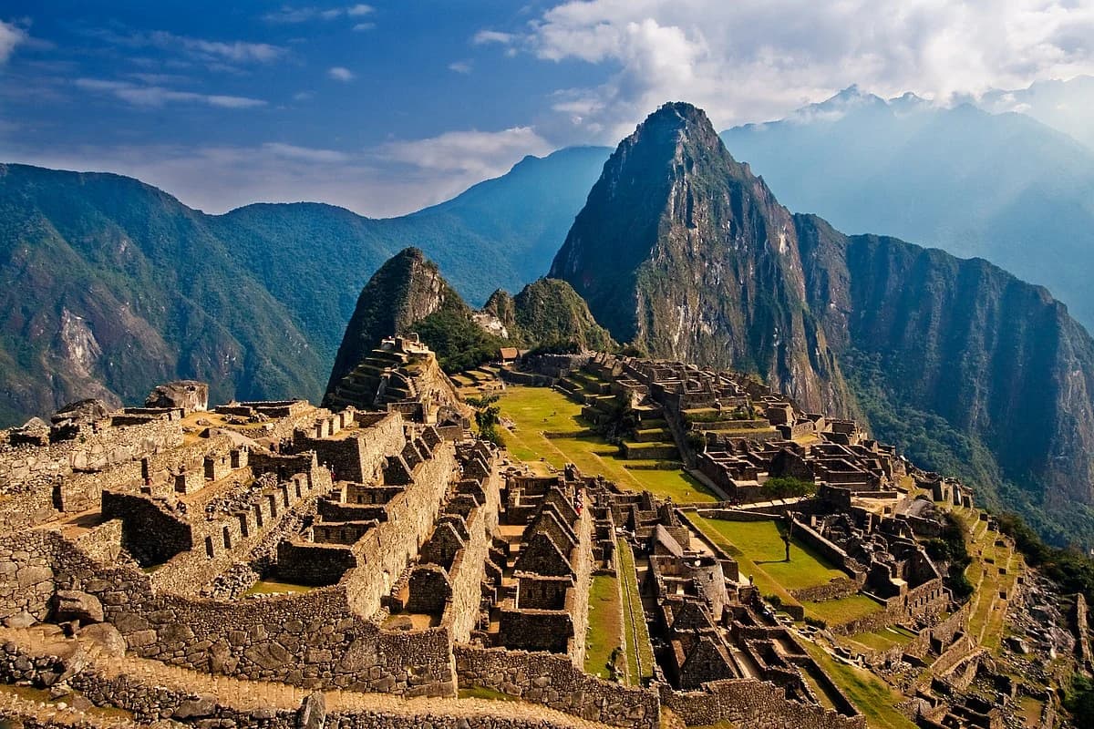 The ancient Incan city of Machu Picchu in Peru, with its stone structures and lush mountains in the background.